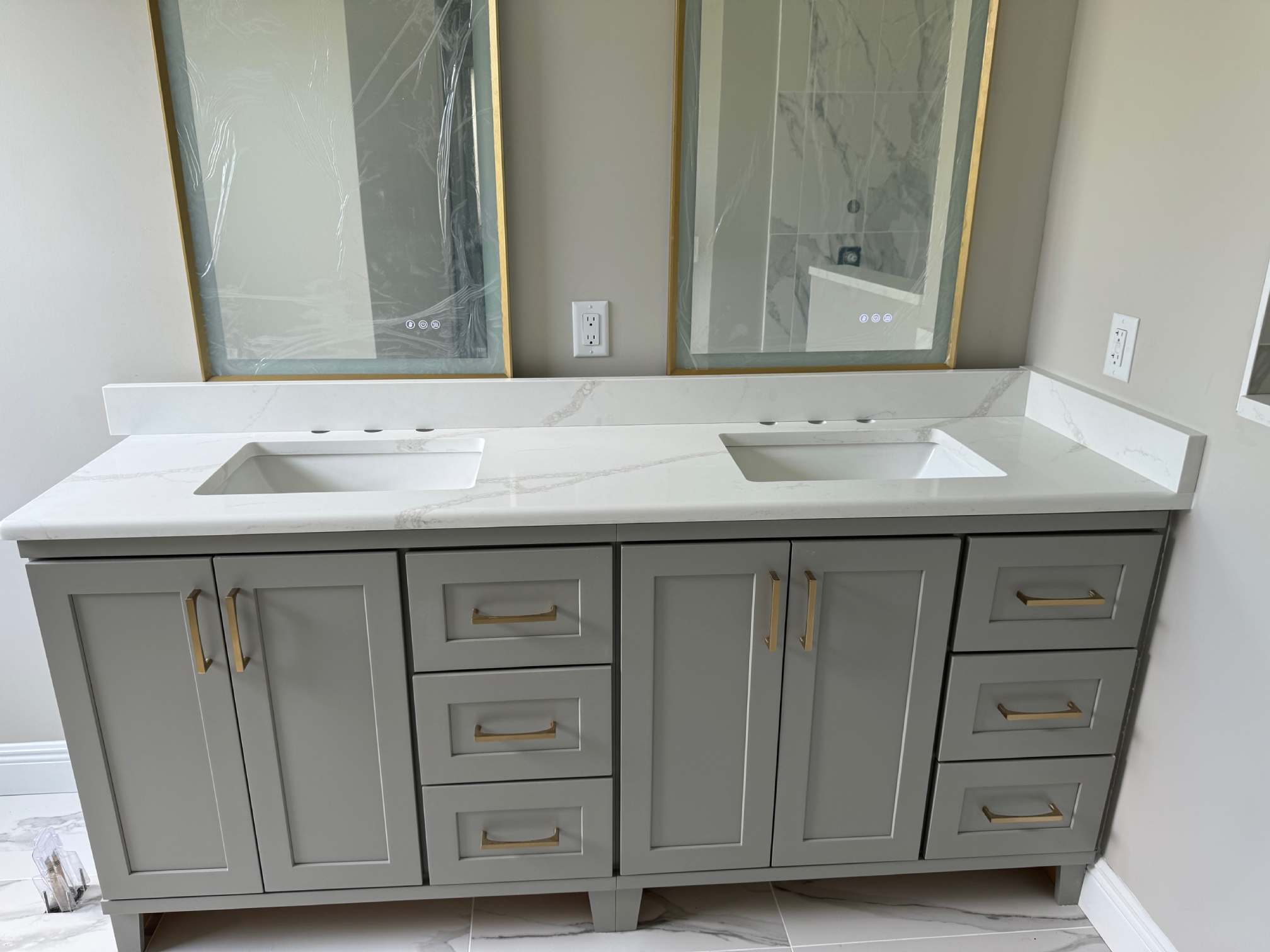 A bathroom with two sinks and mirrors.